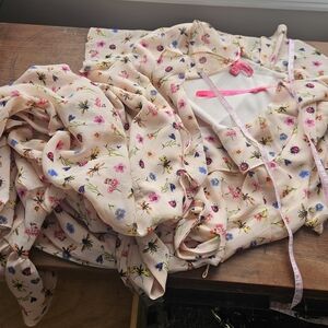 Like new Betsey Johnson sz.8 pink chiffon ruffled printed wrap dress.